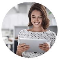 Smiling businesswoman using tablet computer
