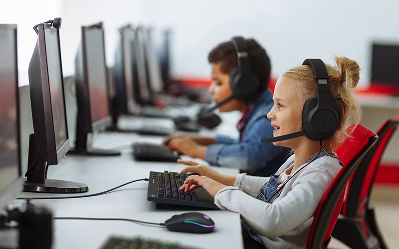 Work hard, play hard. A happy kid palying games