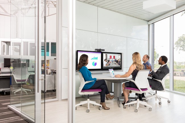 Logitech MeetUp is your all-in-one conference camera designed for huddle rooms and other small spaces. Team having a meeting using Logitech MeetUp