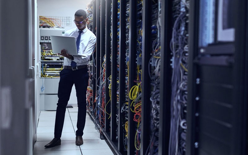 business-man-working-in-server-room