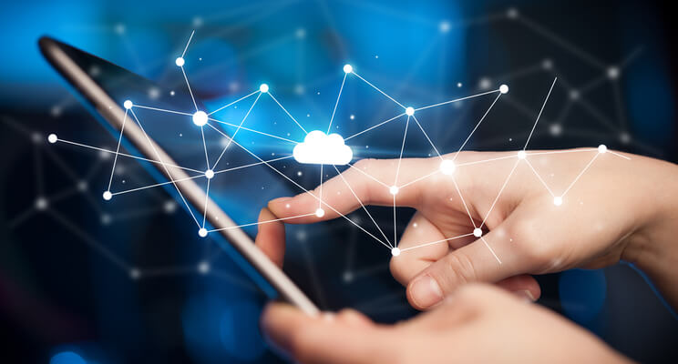 Two business executives walk and discuss cloud technology