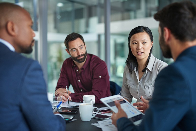 Business team discussing project at conference table