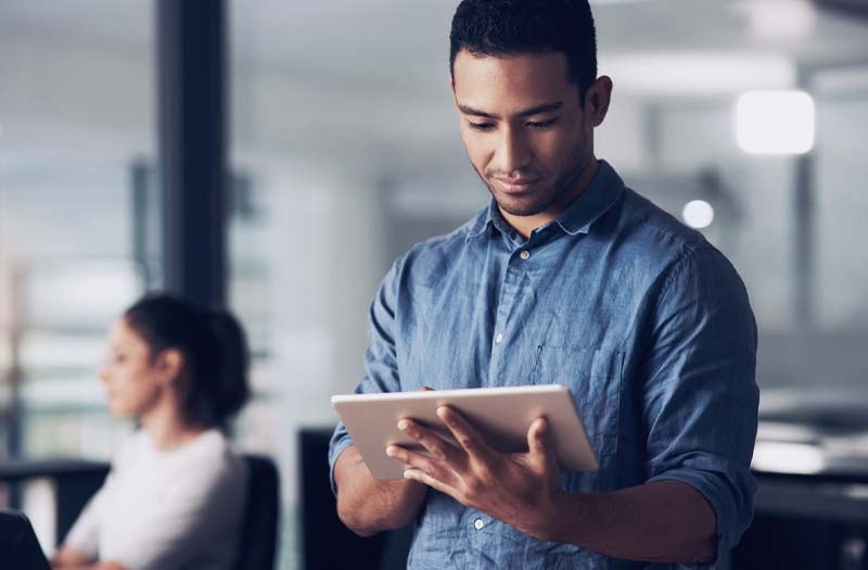 Tablet computer in use in modern office