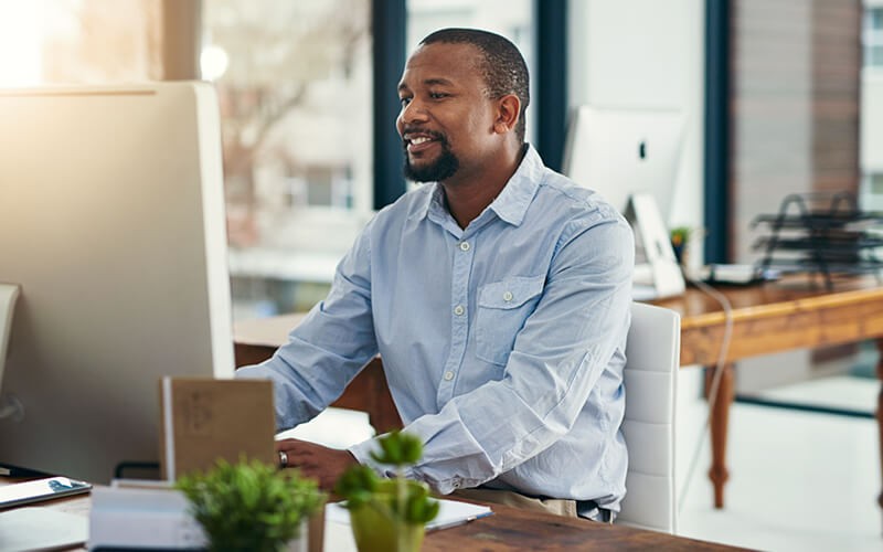 Business man working on workforce applications on desktop computer
